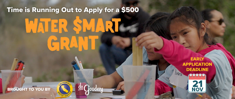 A girl in a blue t-shirt and red undershirt, holds a test strip in a cup of water, similar cups with experiment tools nearby and other students out of focus.   Over the top left, Time is Running Out to Apply for a $500 Water Smart Grant [Logo]. Text reads: Early Application Deadline 21 Nov. Brought to you by [Cal Water logo][DoGoodery logo]